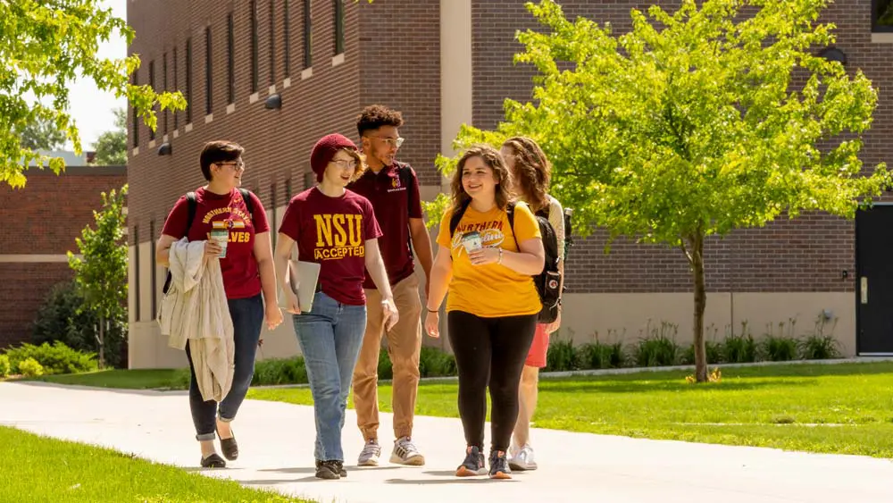 students walking through campus